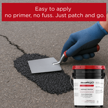 Load image into Gallery viewer, Hand using a trowel to apply asphalt patch onto a cracked pavement surface. Bendmagic Asphalt Patch